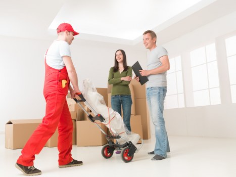 Packed boxes and furniture prepared for a small removal service